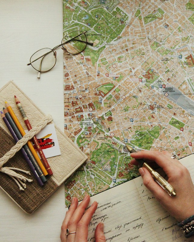 travel tips hand on map planning journey from Philadelphia